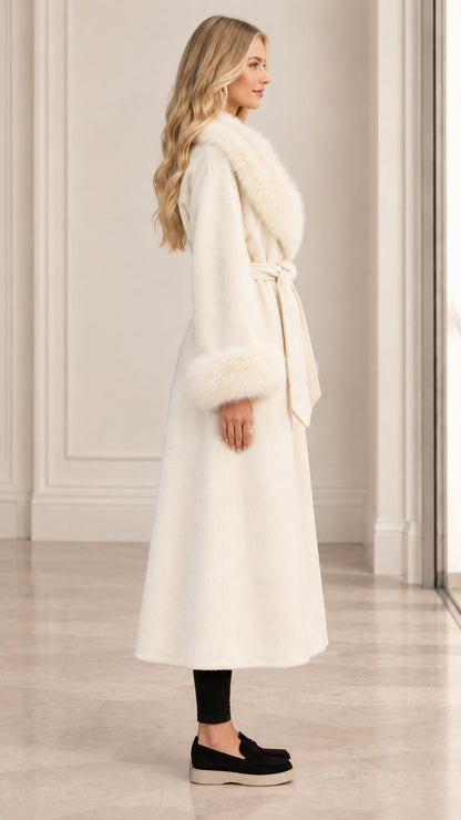Side profile view of women's ivory long wrap coat with faux fur trim