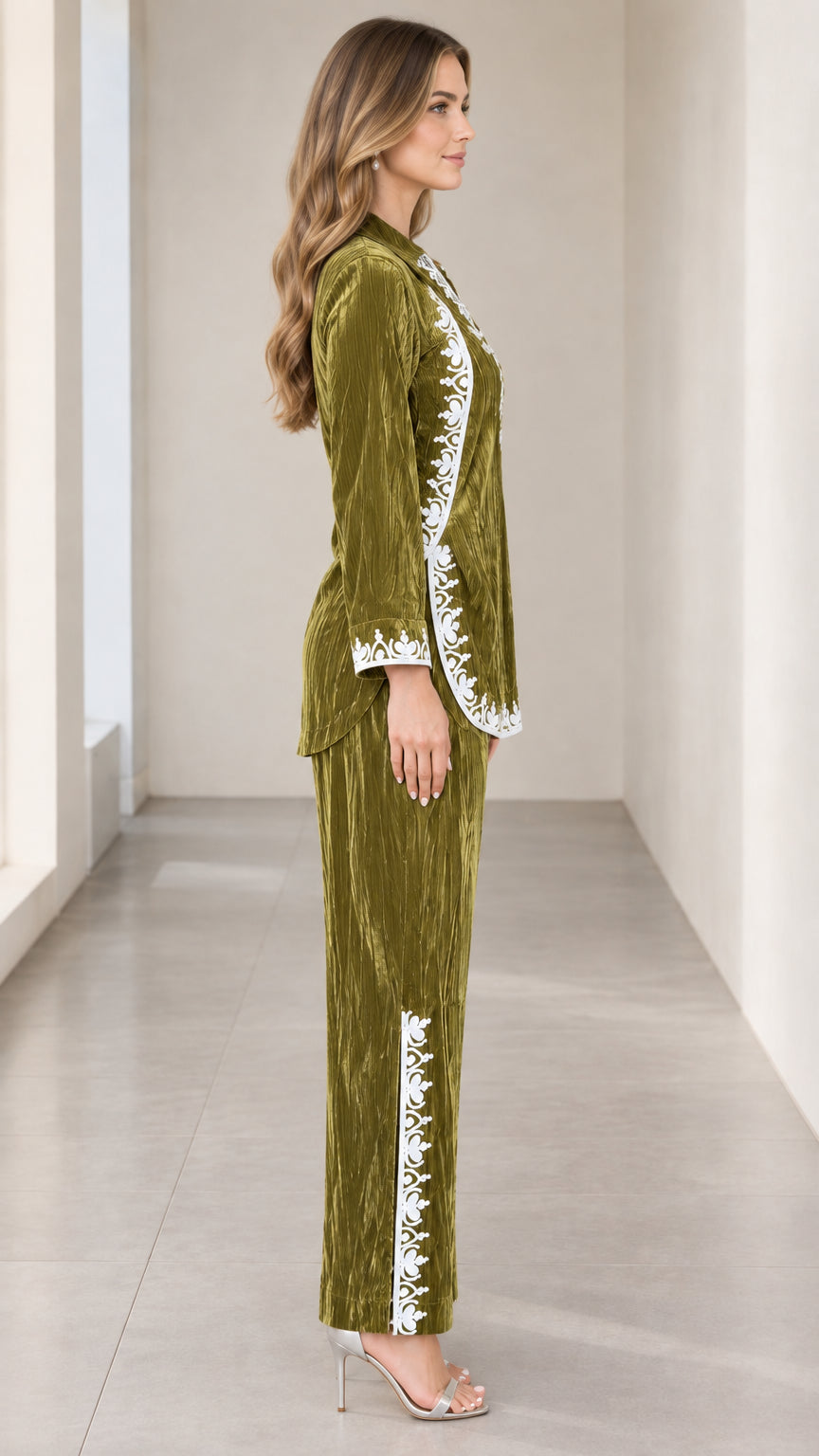 Side profile view of olive green embroidered velvet two-piece outfit