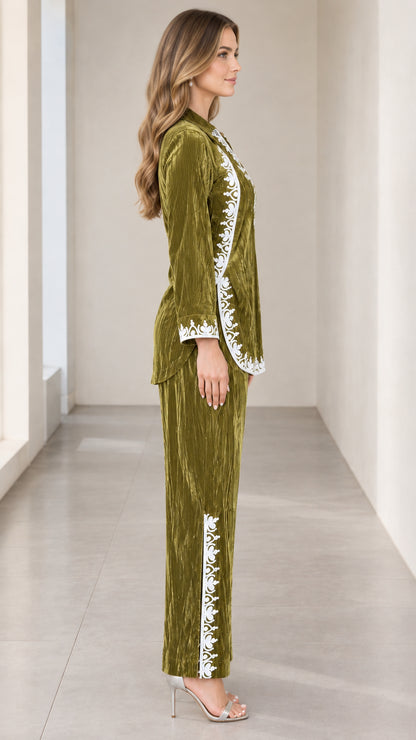 Side profile view of olive green embroidered velvet two-piece outfit