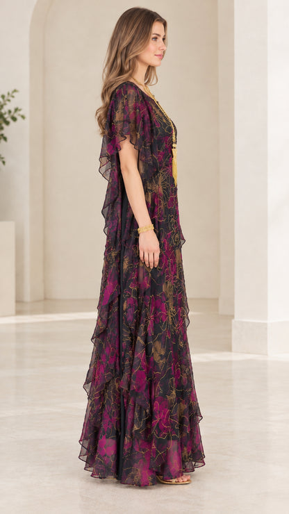 Side angle of model in black floral kaftan maxi dress with flutter sleeves