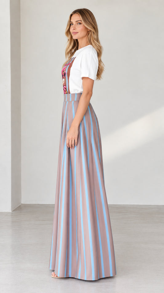 Side profile of woman in graphic t-shirt and pleated striped palazzo pants in mocha
