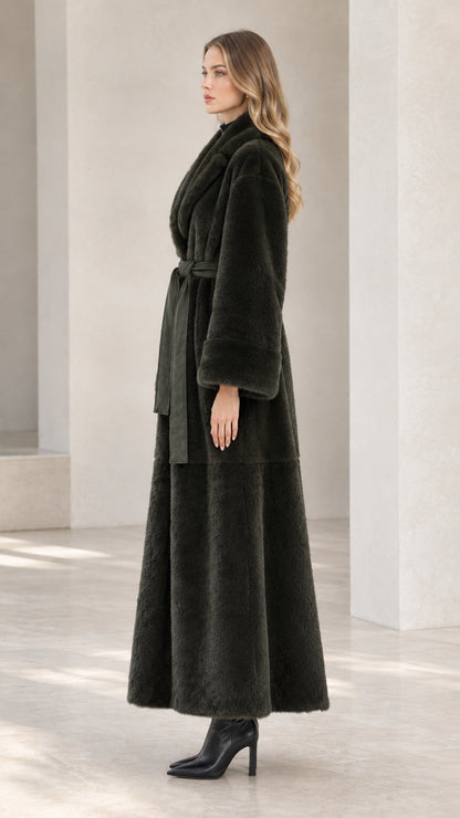 Side profile of dark green floor-length plush coat