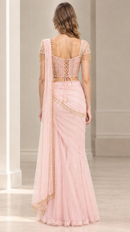 Back view of blush pink saree set showing lace-up corset detail