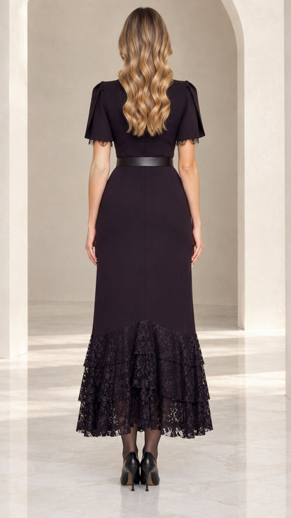 Back view of black flutter sleeve midi dress showing sleek fit and lace hem
