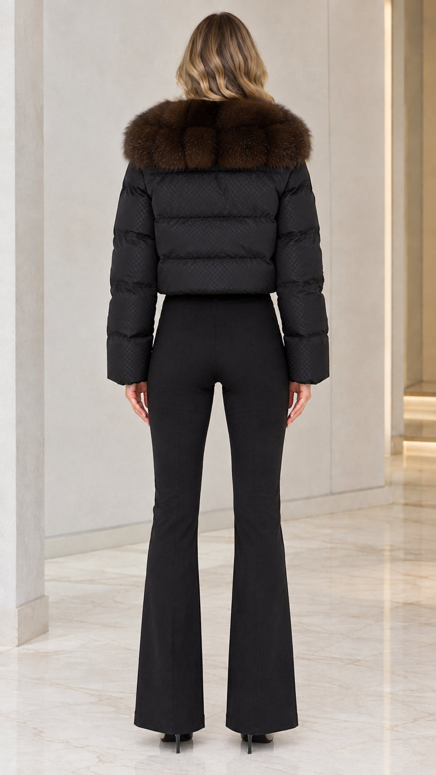 Back view of black cropped insulated jacket showing horizontal quilted baffles and fur collar