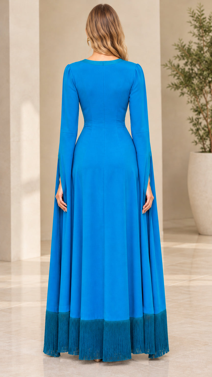 Back view of royal blue floor-length dress showing clean cape sleeve drape