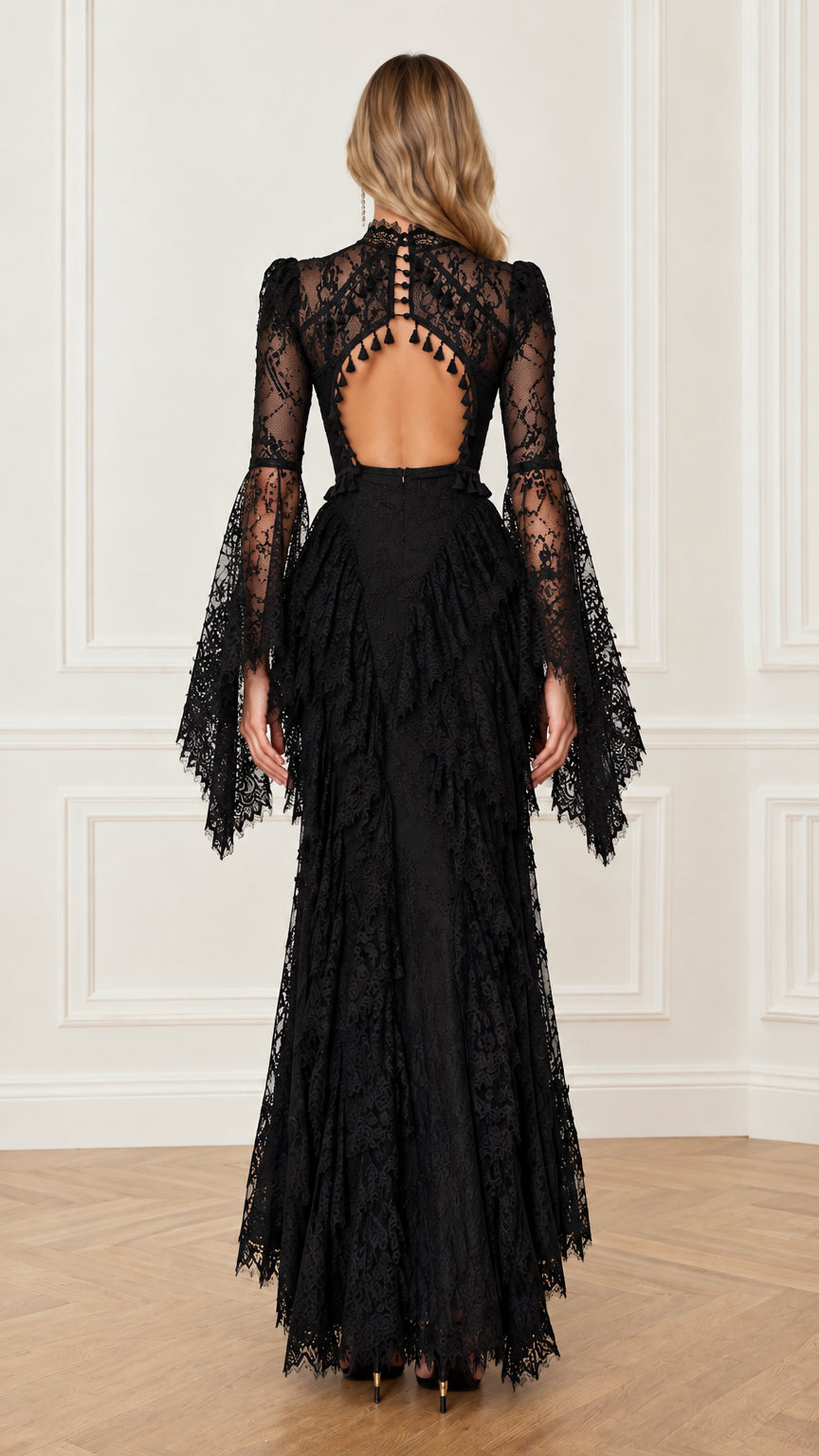 Back view highlighting the keyhole cutout and tassel trim on the black lace dress