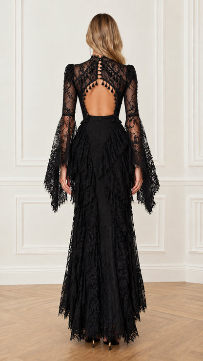 Back view highlighting the keyhole cutout and tassel trim on the black lace dress