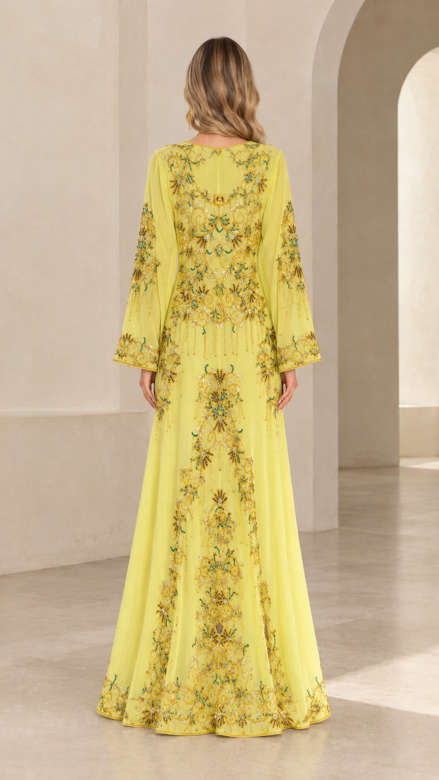 Back full-length view of yellow beaded maxi dress showing intricate embroidery