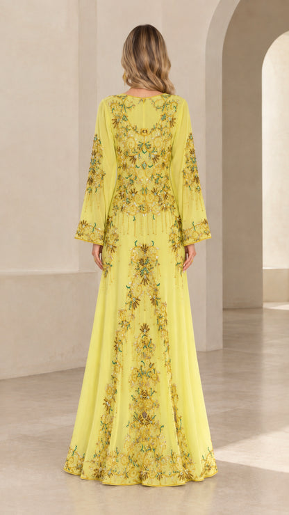 Back full-length view of yellow beaded maxi dress showing intricate embroidery