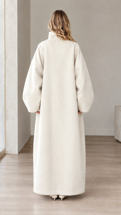 Back view of woman wearing Cream oversized tailored winter overcoat