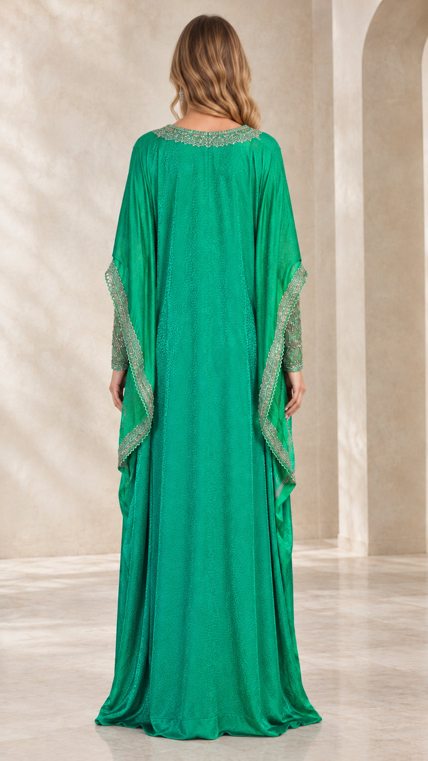 Back view of emerald green floor-length kaftan dress showing draped cape silhouette