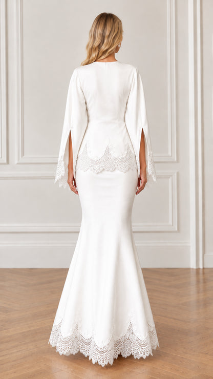 Back full-length view of white mermaid gown with lace hem and split sleeves