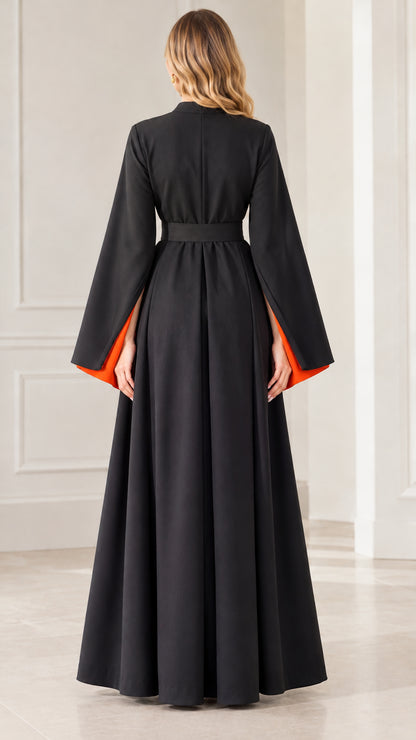 Back full-length view of woman in Black long bell sleeve belted evening dress