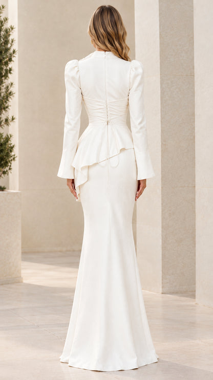 Back view of white peplum gown showing back lace-up detail and fit