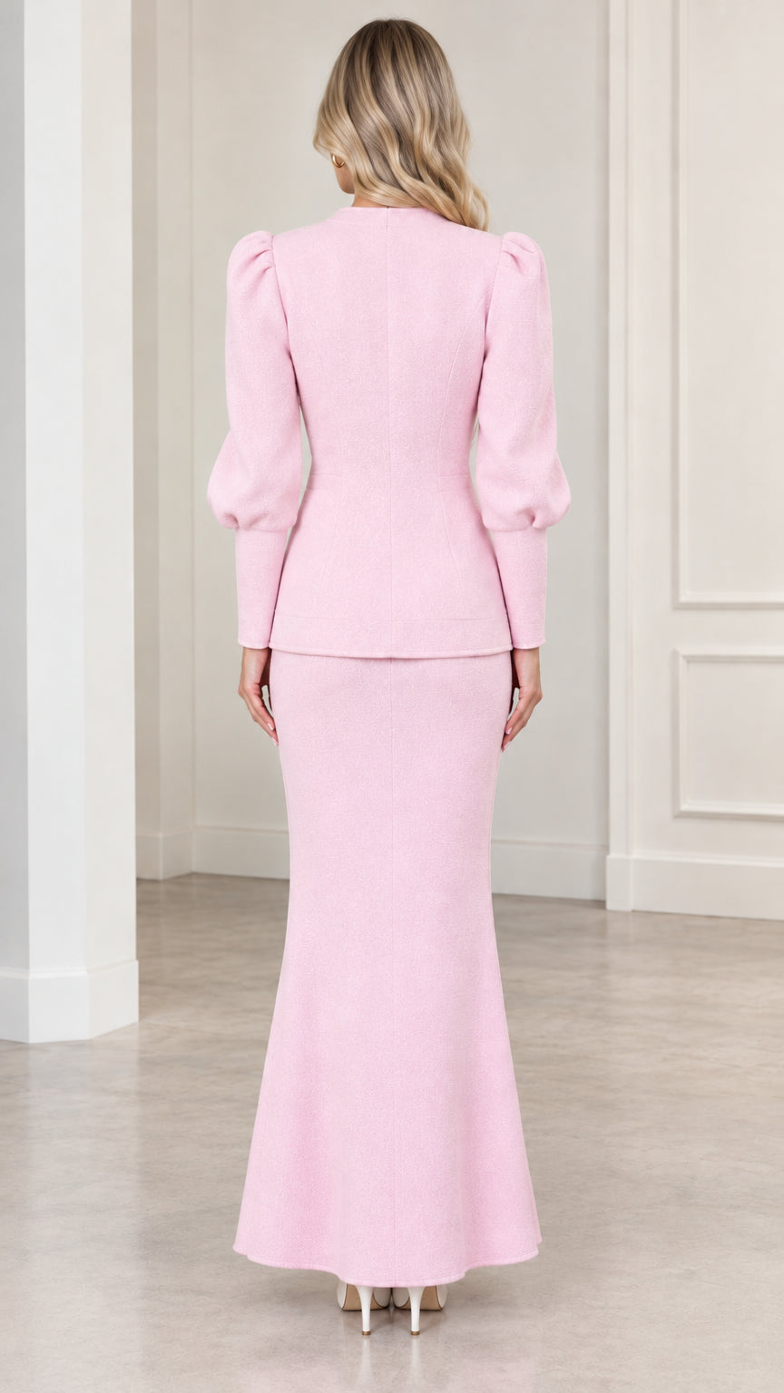 Back view of woman wearing Light Pink puff sleeve jacket and long mermaid skirt