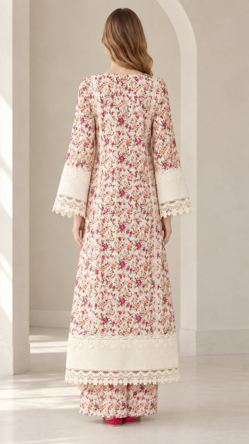Back full view of woman wearing Ivory floral longline tunic and wide leg pants