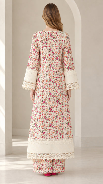 Back full view of woman wearing Ivory floral longline tunic and wide leg pants