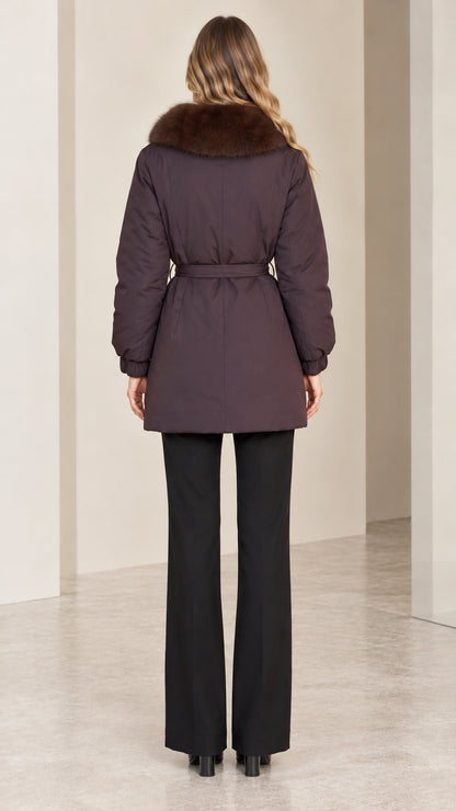 Back view of deep plum belted parka jacket showing length and silhouette
