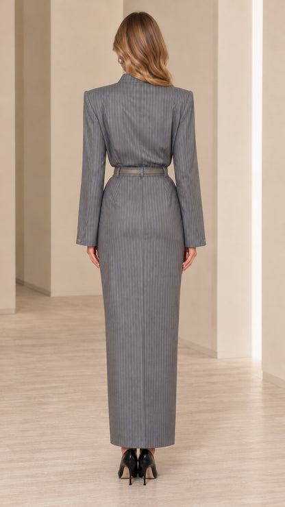 Back view of model wearing grey pinstripe long sleeve maxi dress