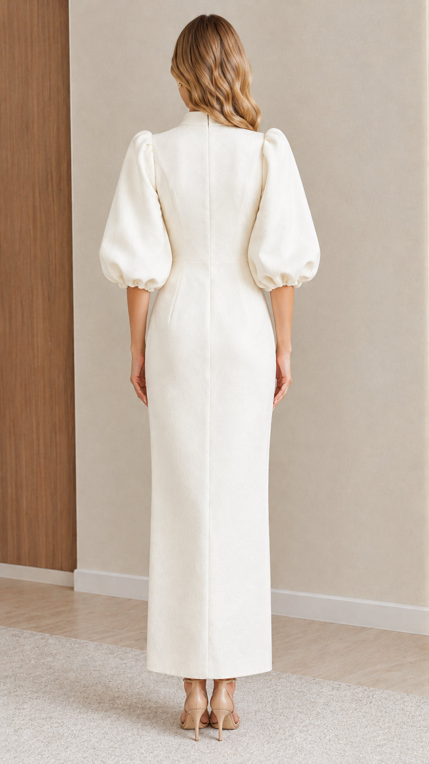 Back view of model wearing the Ivory tailored puff sleeve maxi dress
