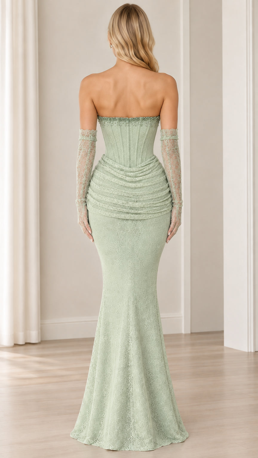 Back view of model in sage green strapless lace maxi gown with opera gloves