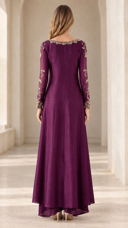 Back full-length view of woman in plum embroidered long tunic and pants set