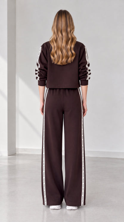 Back view of women's dark brown cropped jacket and wide-leg sweatpants set