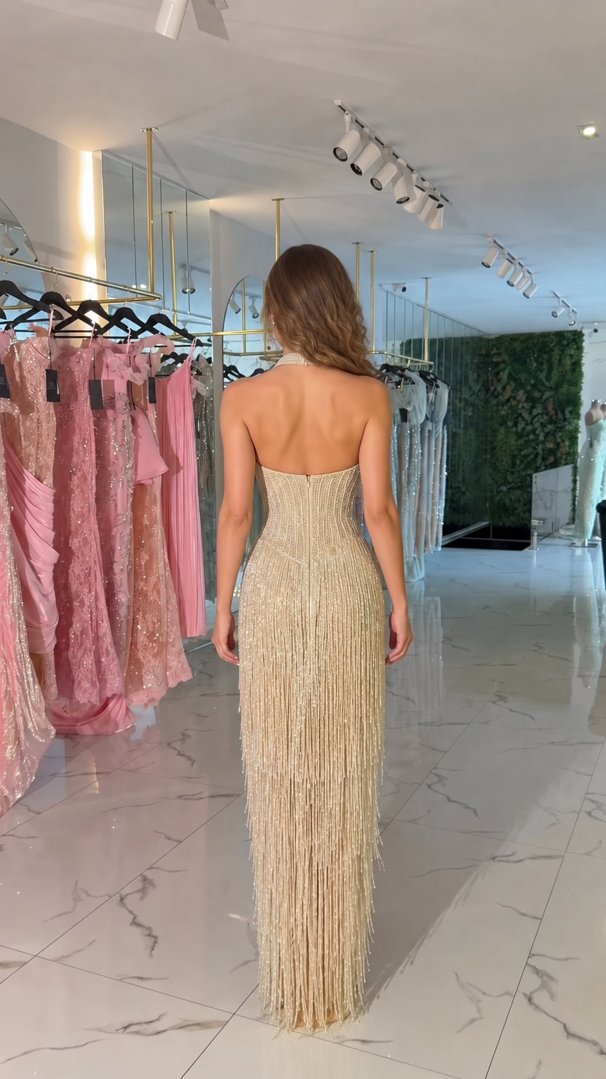 Back view of Champagne open back halter beaded evening gown