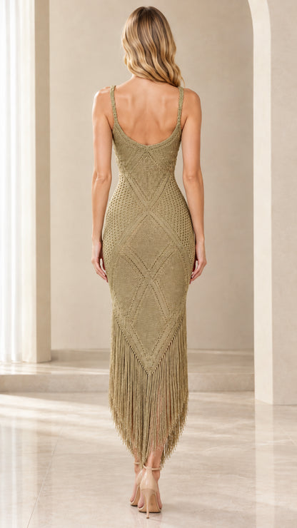Back view of woman wearing olive green crochet knit midi dress showing scoop back
