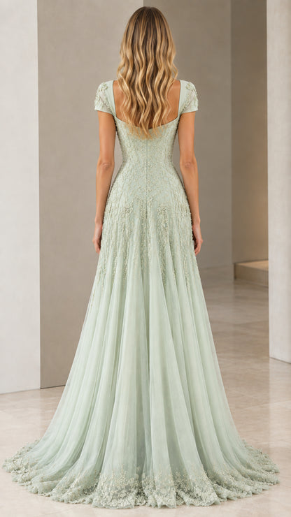 Back view of model wearing Sage Green cap sleeve evening gown with sweeping train