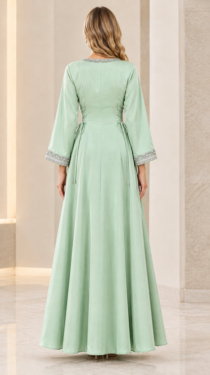 Sage green maxi dress back view featuring corset lace-up waist detail