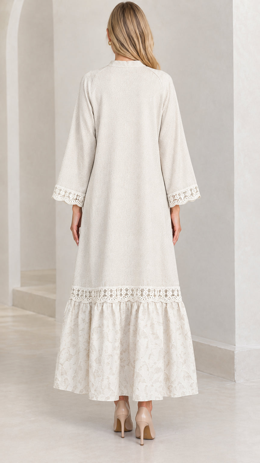 Back view of woman wearing cream long sleeve modest maxi dress