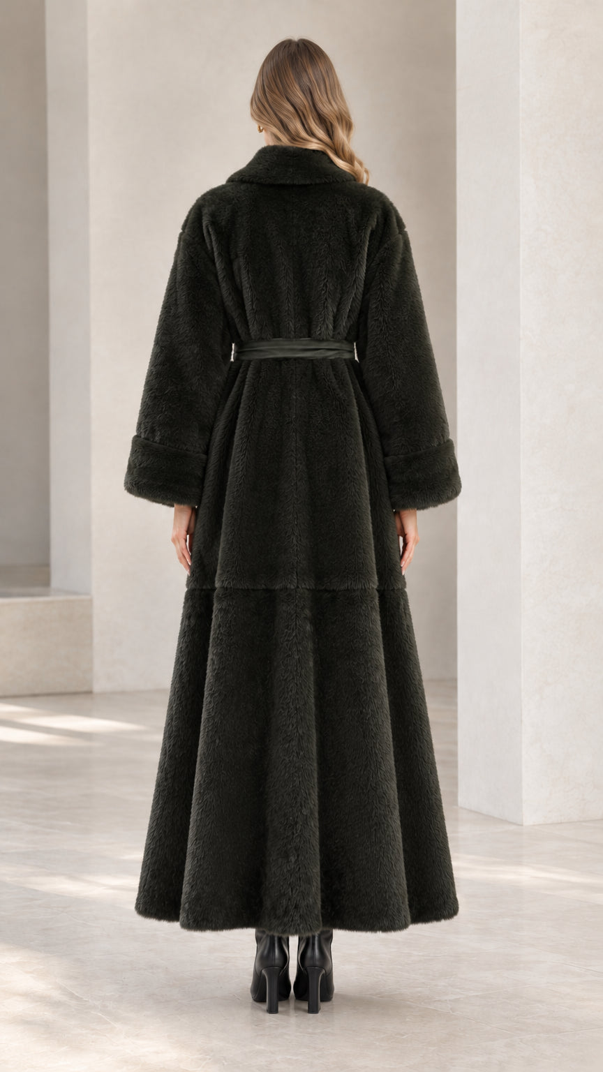 Back view of dark green belted faux fur maxi coat