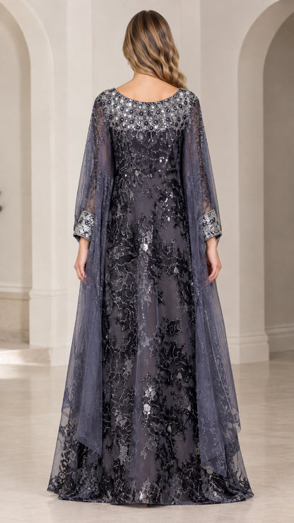 Back view of charcoal grey sequin evening gown showing cascading cape