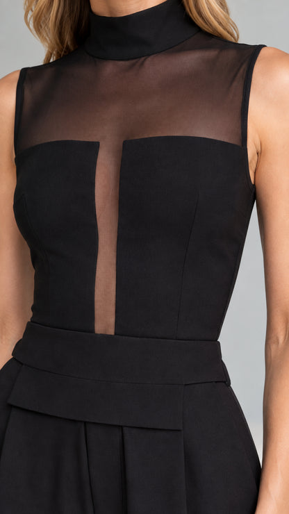 Close up of sheer mesh neckline and bodice detail on black jumpsuit