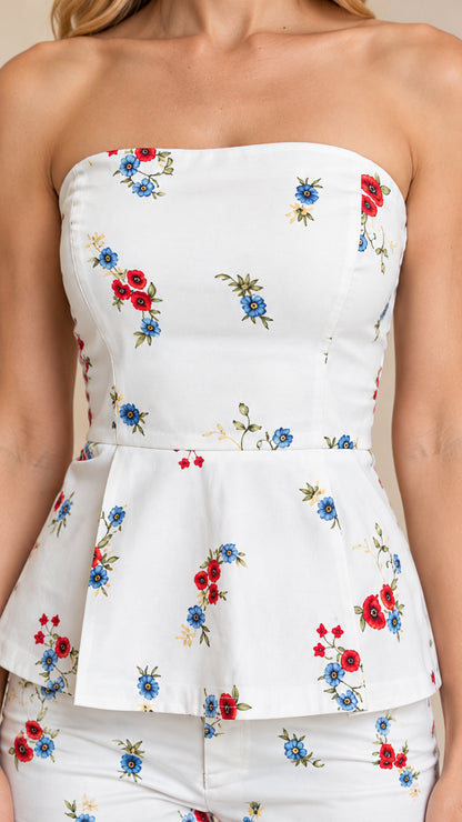 Close-up detail of strapless floral peplum top bodice and flared waist