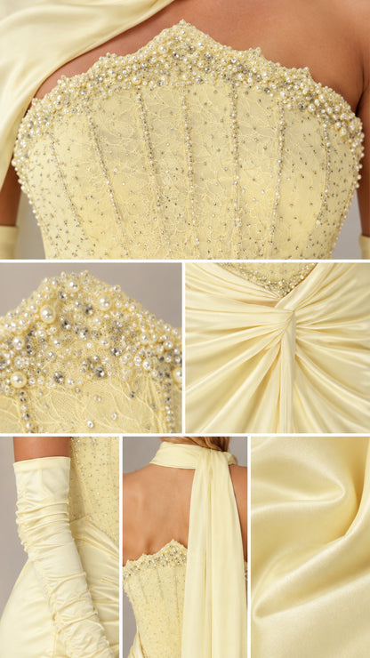 Detailed close-up of intricate beading, corset stitching, and gathered fabric