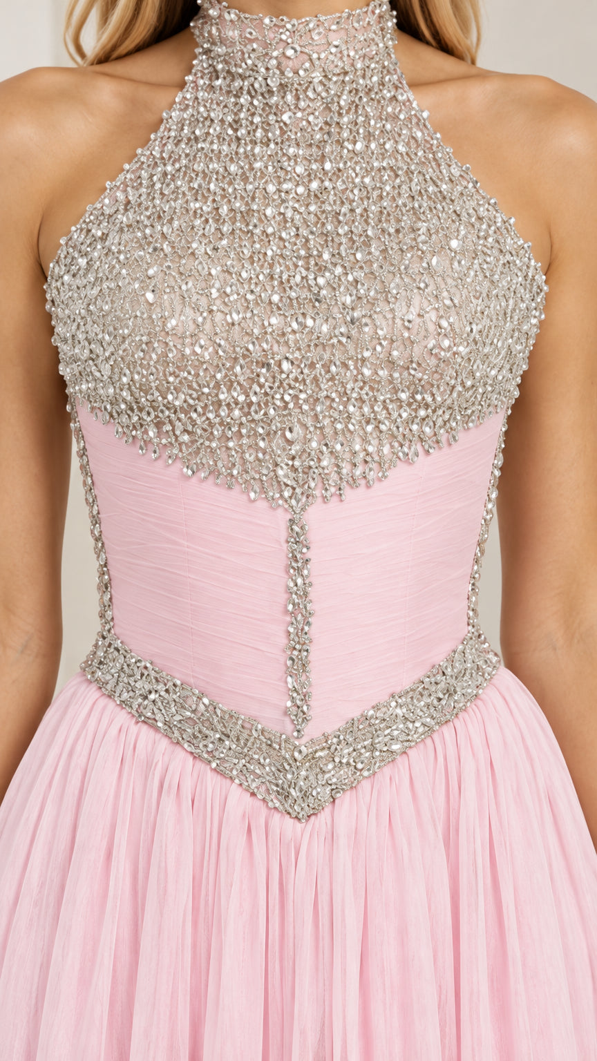 Close up view of intricate rhinestone beading and corset seam detailing on pink bodice