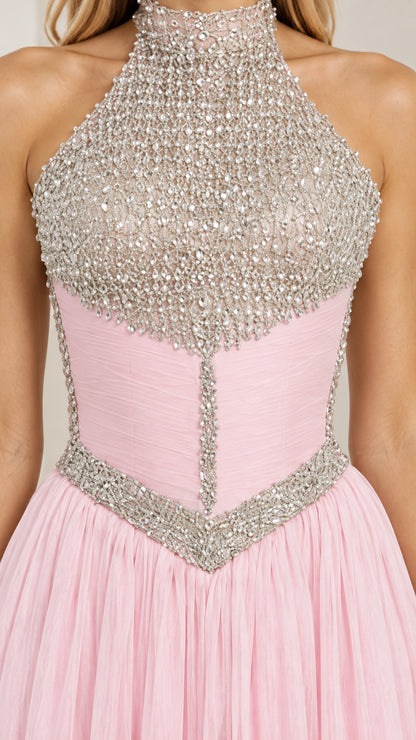 Close up view of intricate rhinestone beading and corset seam detailing on pink bodice