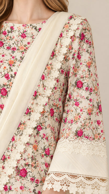 Close-up detail of floral pattern, boat neckline, and intricate lace sleeve cuff