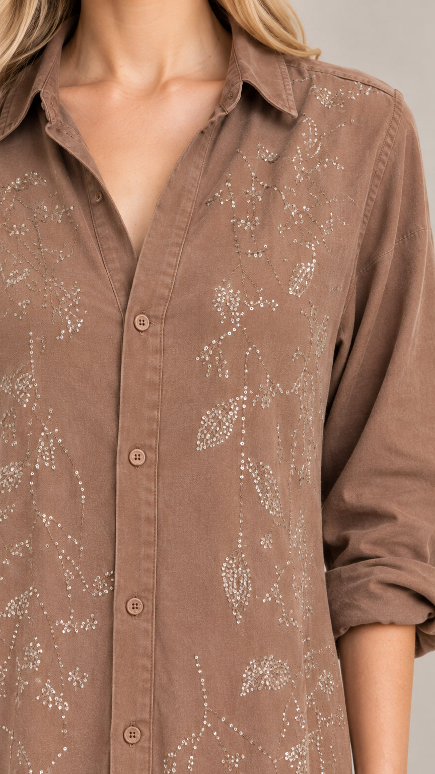 Close-up detail of botanical embroidery on collared shirt dress