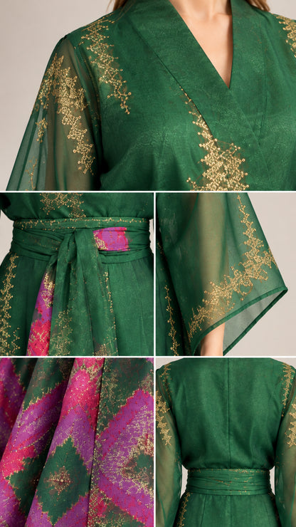 Close-up details of gold-tone pattern and belt on emerald green kimono dress