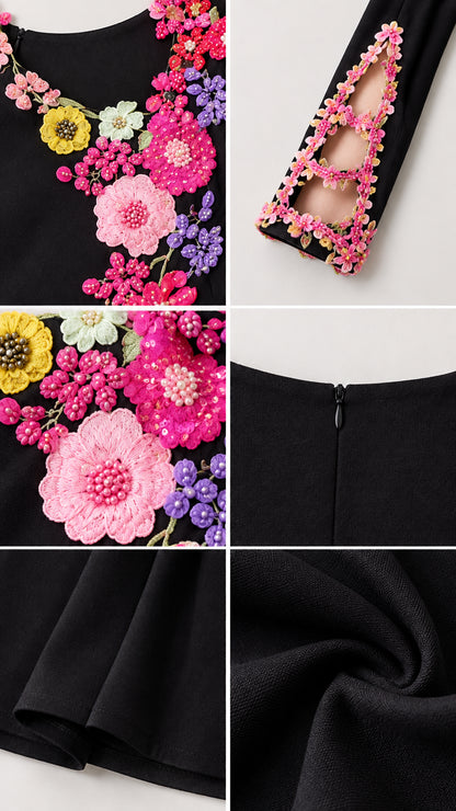 Close up view of neckline floral appliqués, embroidered cutout sleeve cuffs, and fabric texture
