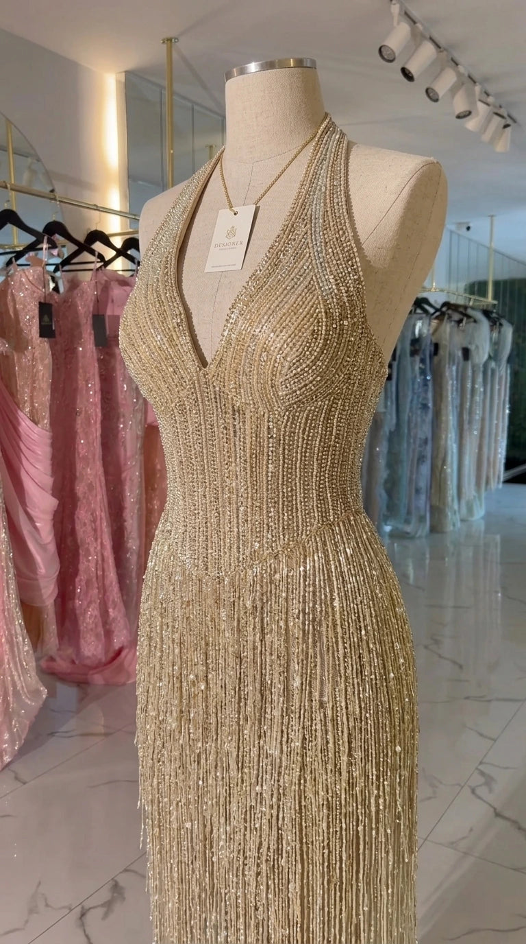 Mannequin close-up of Champagne beaded halter bodice and tassel fringe detail