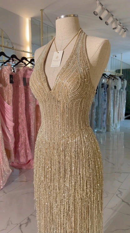 Mannequin close-up of Champagne beaded halter bodice and tassel fringe detail
