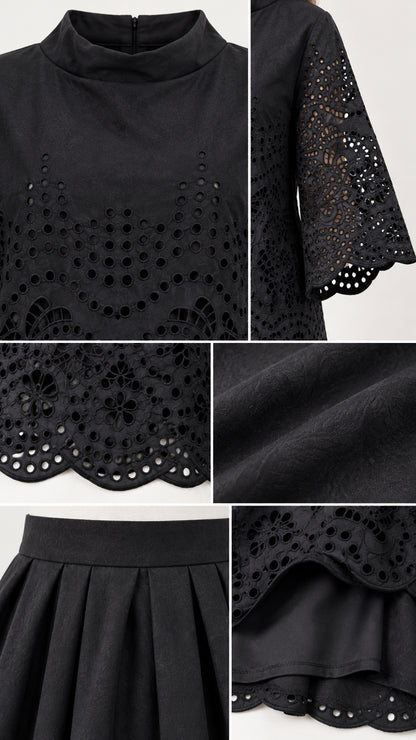 Close-up details of black eyelet cutwork embroidery, mock neck collar, pleated waist, and fabric texture