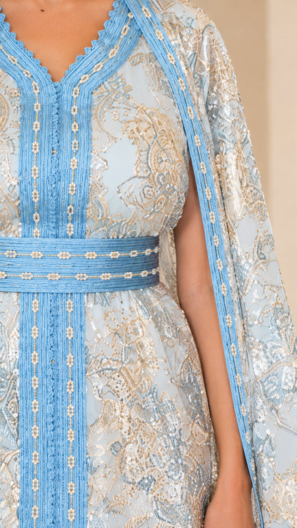 Close-up detail of Light Blue metallic jacquard fabric, braided trim, and waist belt