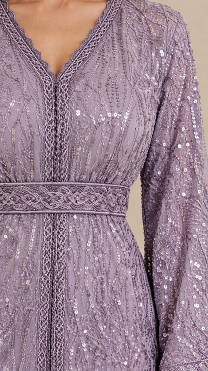 Close-up detail of V-neckline embroidery, braided trim, and delicate sequin pattern on Lilac dress