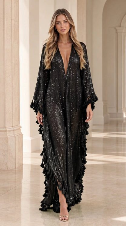 Woman wearing black sequin fringe maxi caftan plunge neck dress